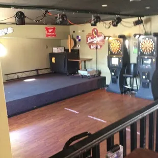Stage for live music and dart league area