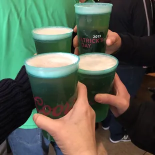 a group of people holding drinks