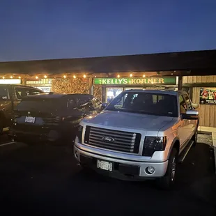 a pickup truck parked in front of a restaurant