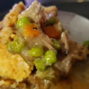 a spoon full of pot pies