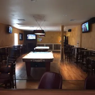 a pool table and televisions