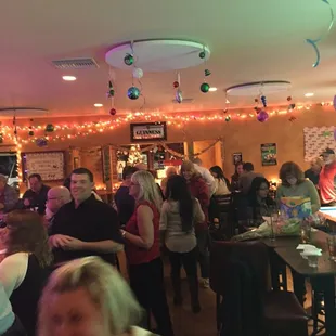 a crowd of people in a pub