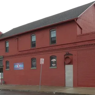 a red building on a street corner