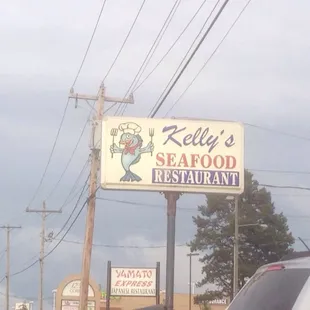 a sign for kelly&apos;s seafood restaurant