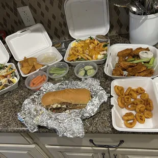 Steak and chicken salad, dry Cajun wings, fried hot pepper rings a Philly steak sandwich and hummus and veges