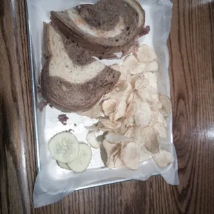 Reuben with chips and pickles