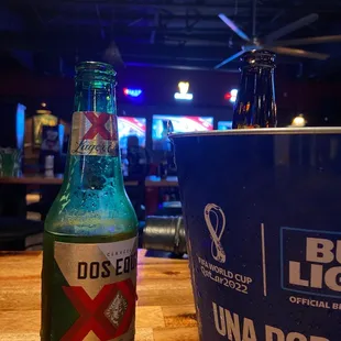 a bottle of bud light and a bucket of beer