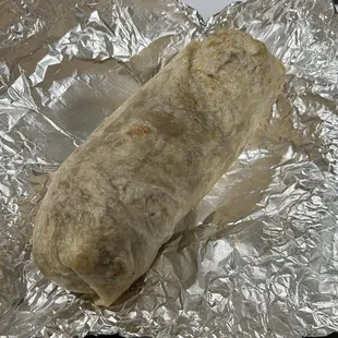 Spicy Beef Burrito With Rice &amp; Beans. Picture does no justice.. Burrito is huge, and meat was fresh.