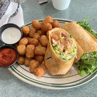 Firecracker chicken with tater tots extra lettuce, a pickle and ketchup and ranch. Fabulous