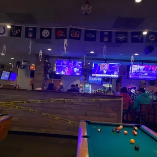 a pool table and a bar