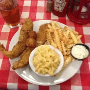 Cajun catfish with French fries and macaroni and cheese! And the only drink to have with this meal, sweet tea!