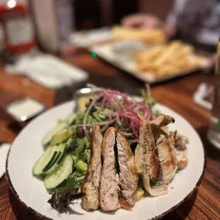 Mixed green salad with chicken