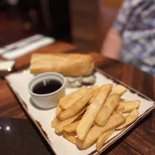 Beef dip sandwich with French fries