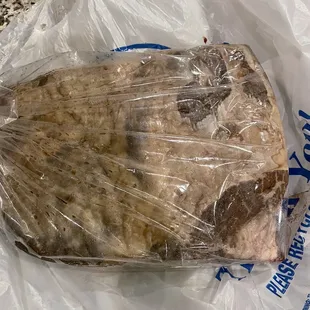 a piece of meat wrapped in plastic