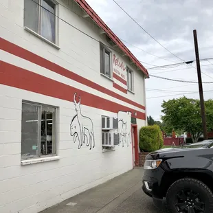 a truck parked in front of a building