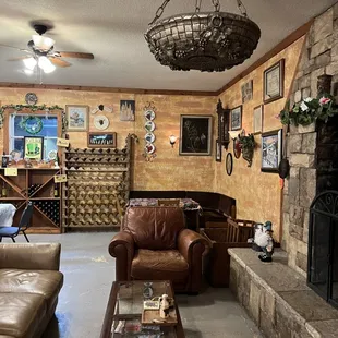 a living room with a stone fireplace