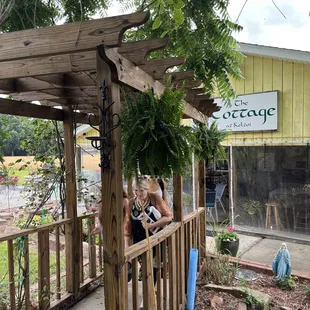 two people sitting on a porch