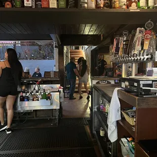 a woman standing at the bar