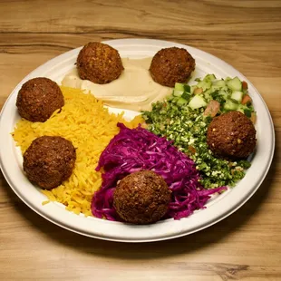 Crispy chickpea fritters, golden-brown perfection outside, tender inside, bursting with Middle Eastern spices,.