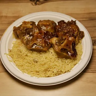 Slow-cooked perfection with vibrant spices creates a savory, tender delight that captures the essence of Caribbean culinary excellence.