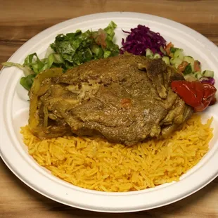 Succulent lamb chops, slow-cooked with aromatic spices, offering a mouthwatering blend of tenderness and rich flavors for a delightful dinin