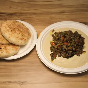 A luscious blend of chickpeas, tahini, olive oil, and garlic, creating a smooth, flavorful dip perfect for any occasion.