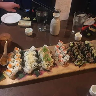 Sushi rolls on a deckless skateboard, perfect plating &amp; delicious garnishings.