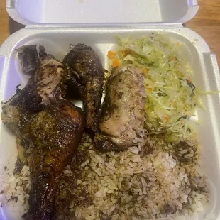 Jerk Chicken, rice oxtail gravy and cabbage