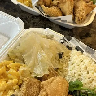 Pork chop with wings, Mac n cheese, cabbage and rice.... Whiting fish, wings, Mac n cheese and fried okra