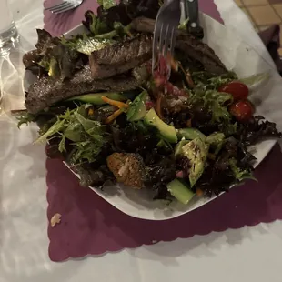 Full size steak salad with house dressing.
