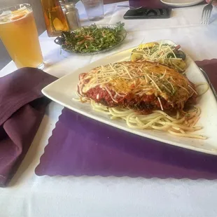 Parmesan chicken with red sauce, fresh house salad and a blue moon