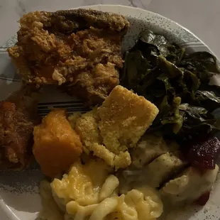 Veggie plate.  Candied yams, collard greens, macaroni and cheese and dressing.    Chicken is from a different place.
