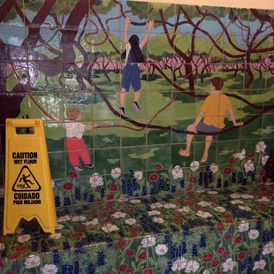 Really great tile mural w a built in bench in a humble ladies room @ this rest stop in Kenedy. Wow!