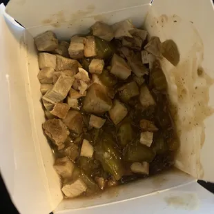 an open takeout box of food