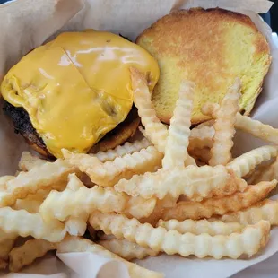 Plain cheeseburger with bland crinkle fries