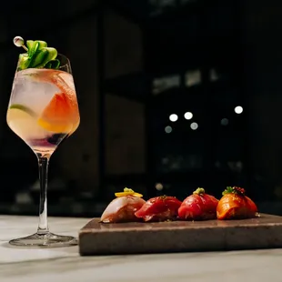 a glass of wine and strawberries