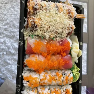 a tray of sushi on a table