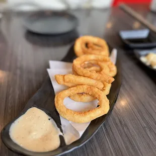 Calamari as of December 2023 -- slight change to plating and mini salad is gone.