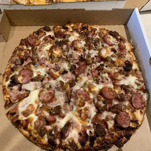 Four meat pizza - brisket, ham, sausage, &amp; chicken. This pizza is loaded with meat in ever delicious bite