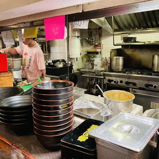 a chef preparing food in a commercial kitchen
