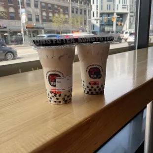 two cups of iced coffee on a table