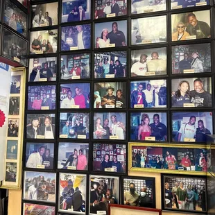 a wall full of family photos