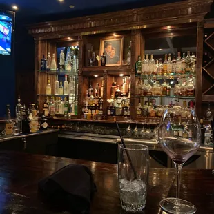 a bar with a large screen tv