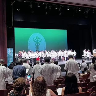 JABSOM Class of 2024 with their white coats.
