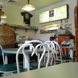 ows a man sitting at a table