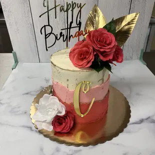 a birthday cake with roses