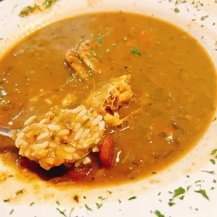 a spoon in a bowl of soup