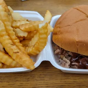 BBQ pork sandwich with crinkle cut fries