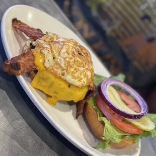 Bacon cheese burger (he added an egg)