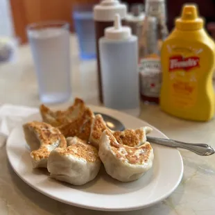 a plate of dumplings on a table
